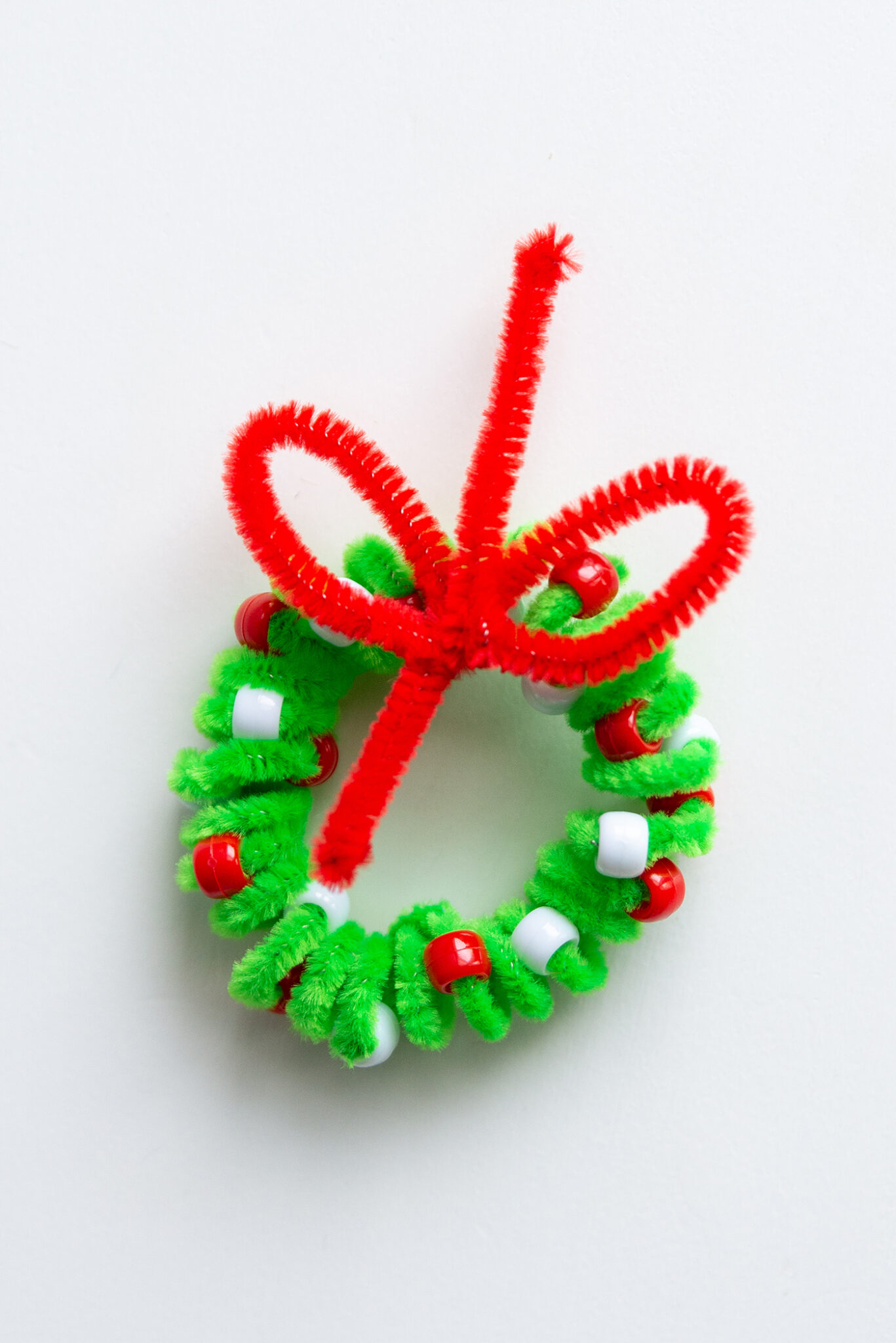 A pipe cleaner wreath ornament, symbolizing the intricate and complex nature of Tara Terrorful's disappearance
